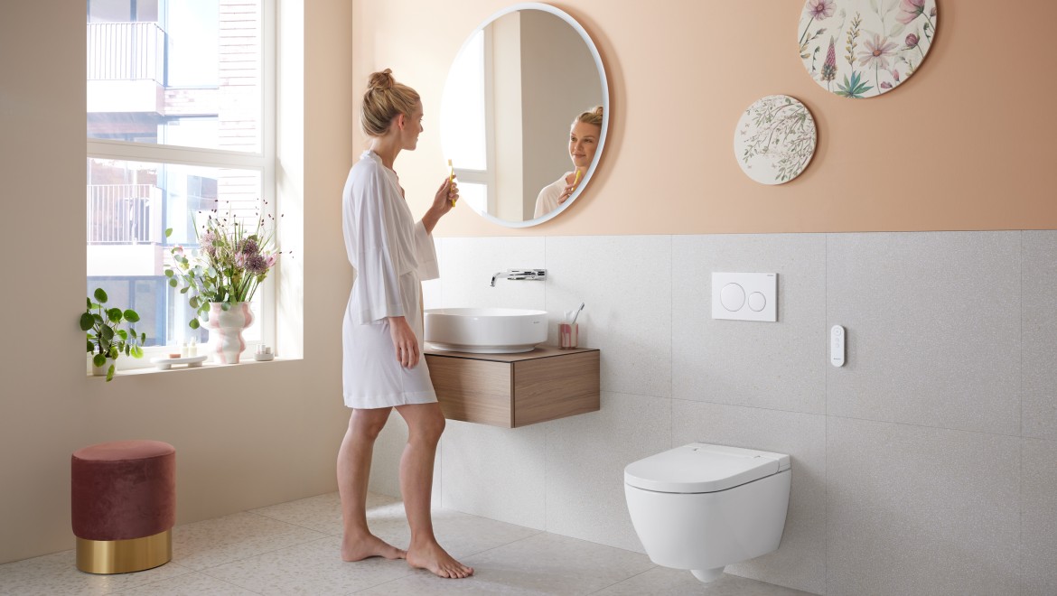 Bathroom in trendy Peach Fuzz with a shower toilet