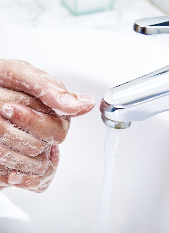 Washing hands in the washbasin